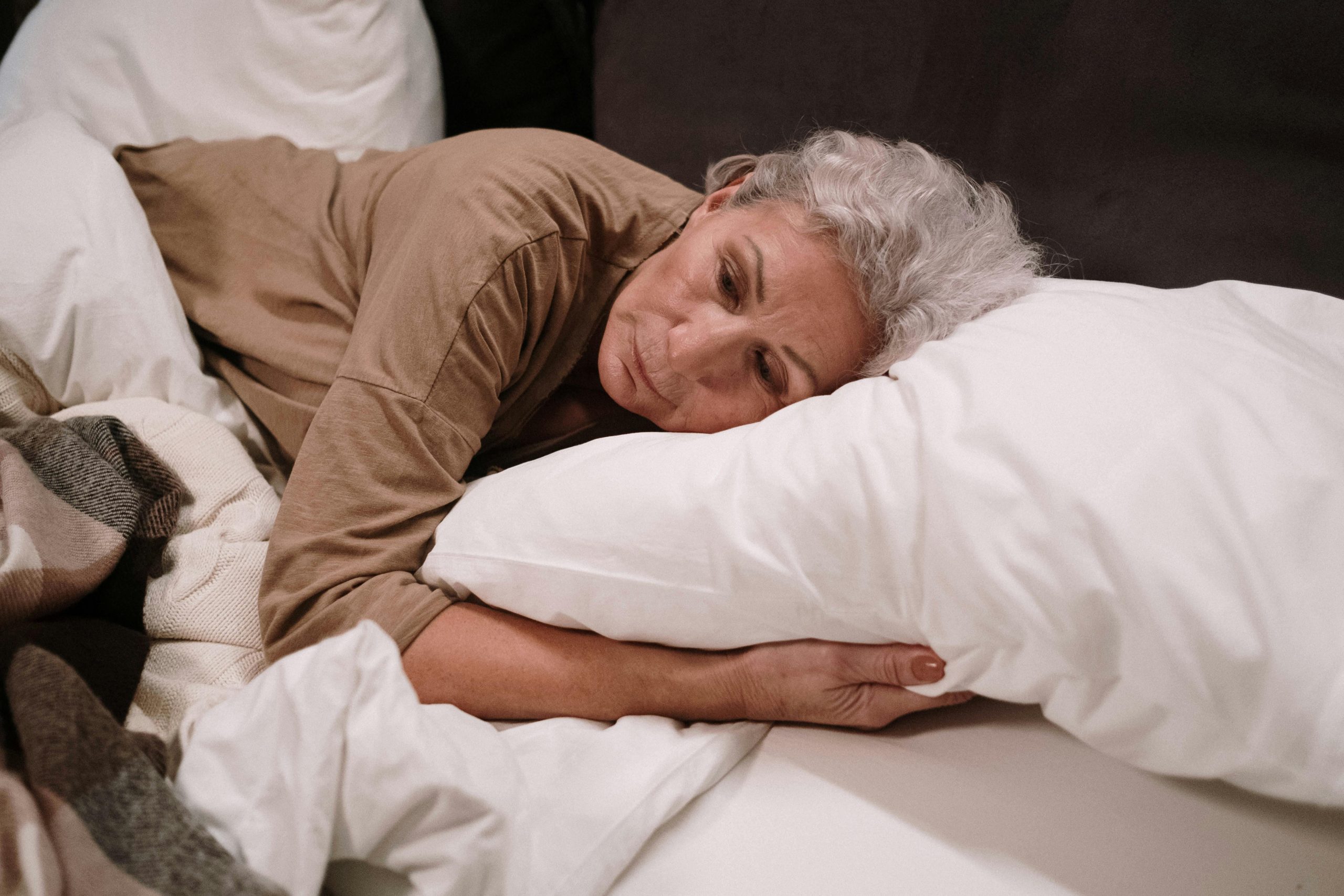 Woman experiencing menopause and sleep disruption awake at 3am